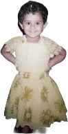 Manya as a little girl, hands on her hips